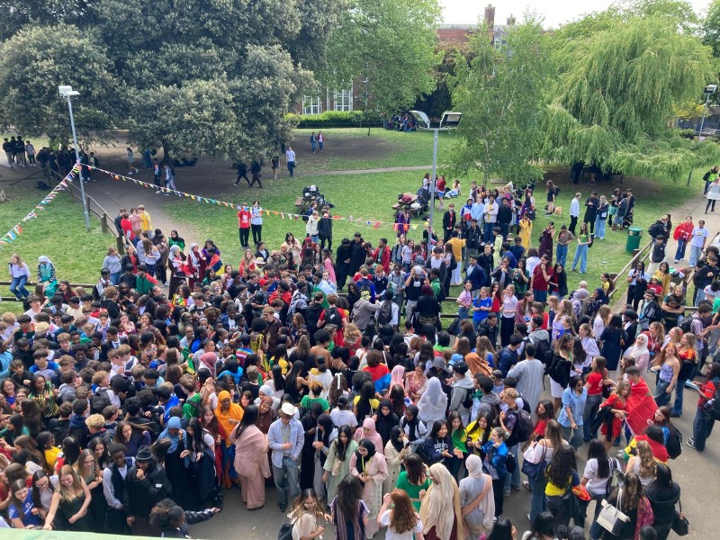 Large group of students gathered on lawns for Graveney for Peace Day