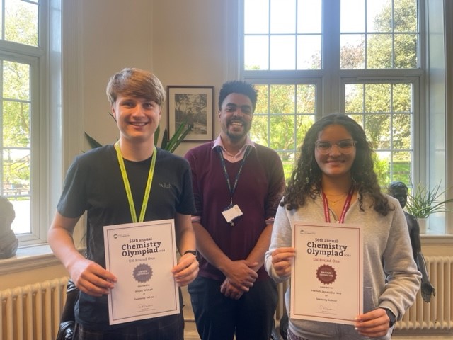 Chemistry Olympiad 2024 students holding certificates