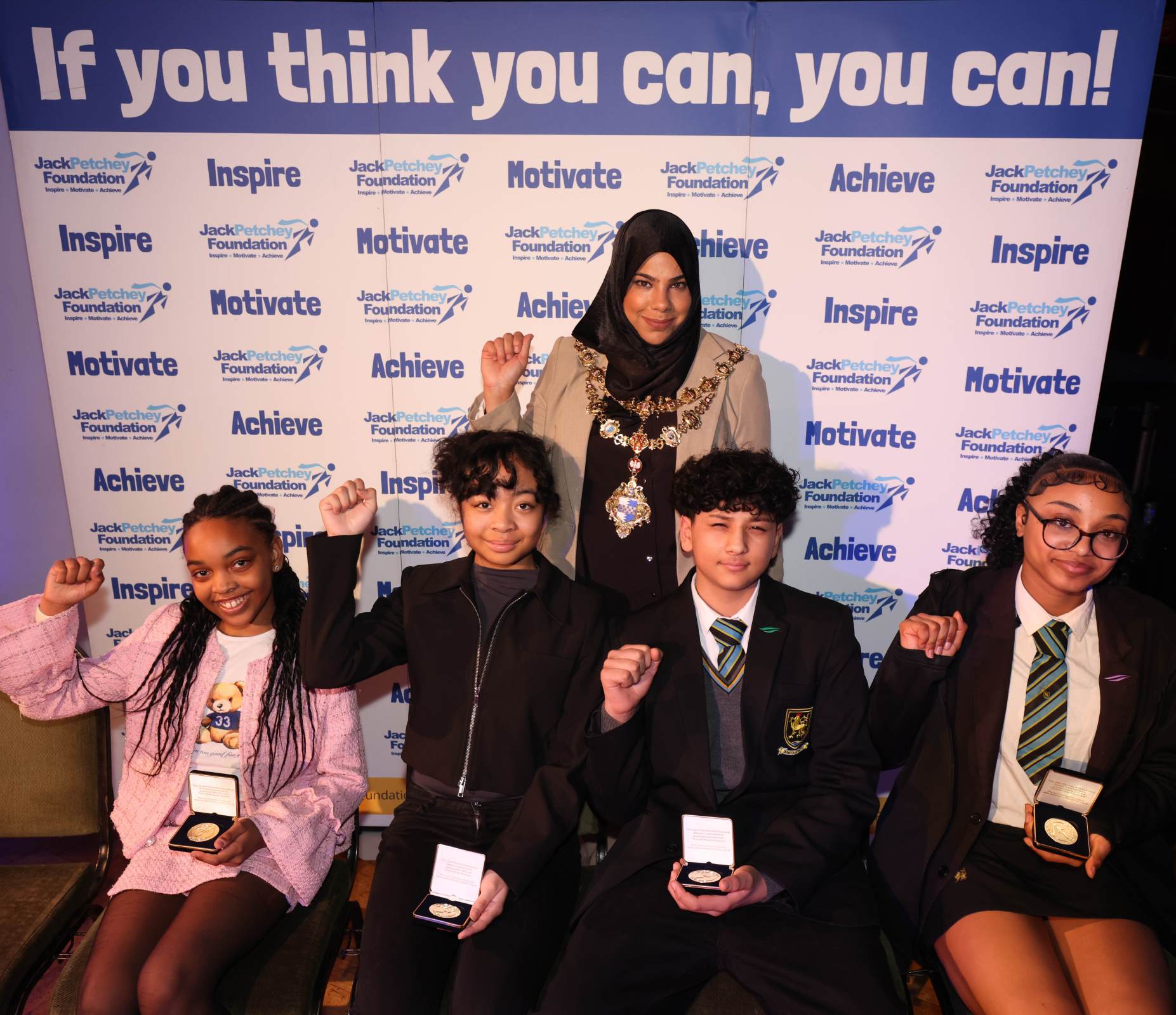 Jack Petchey award winners holding their award medals